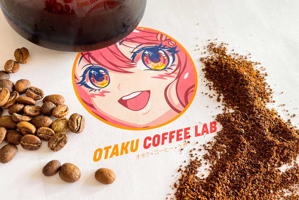Otaku Coffee Lab's Logo surrounded by whole coffee beans, and ground coffee beans